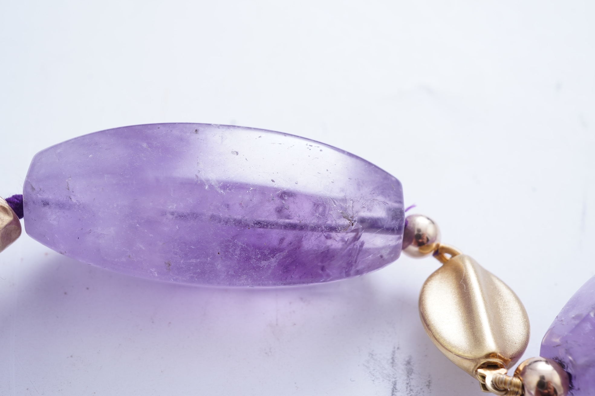 An amethyst and gold necklace